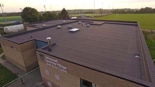 Drone shot of our reinforced bitumen roofing on college building