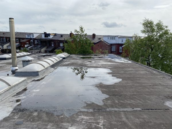 ponding water on flat roofs
